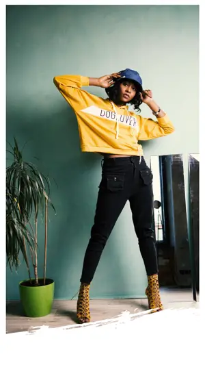 A Woman Wearing A Yellow Shirt And Black Pants Classy Template