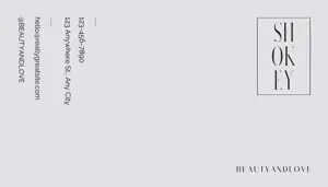 A White Envelope With A Black And White Logo Business Card Template