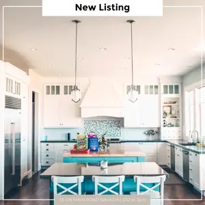 A Kitchen With White Cabinets And A Blue Island Real Estate Template