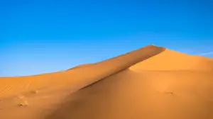 A Large Sand Dune With A Blue Sky In The Background Zoom Backgrounds Template