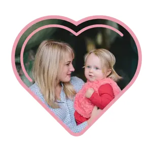 A Woman Holding A Baby In Front Of A Heart Template